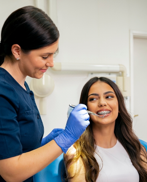 Young woman with braces visiting her orthodontist