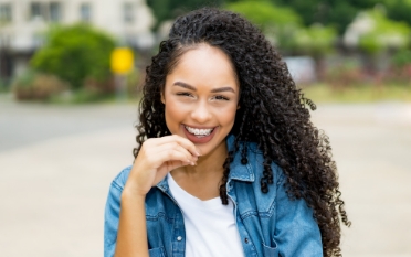 Smiling adult woman with braces